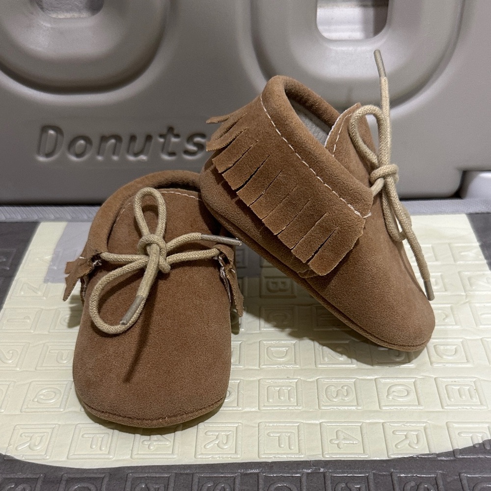 Brown Suede Kids Moccasins for babies. Soft, comfortable, and stylish.